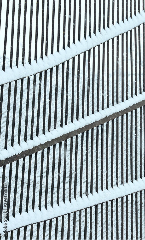 snow on the metal fence snow on the metal fence