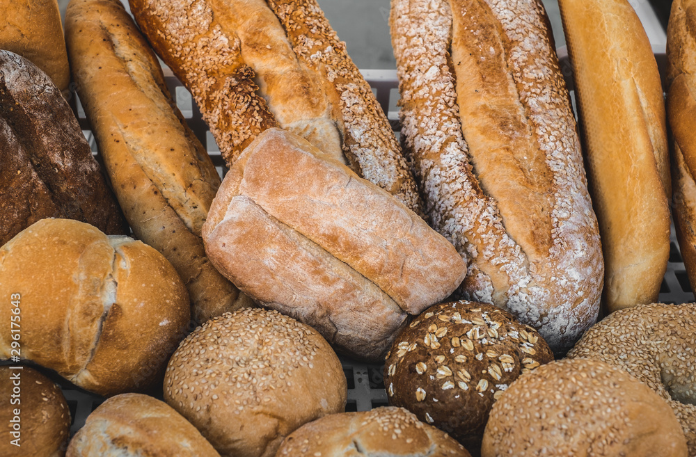 various types of freshly baked bread arranged in the crate