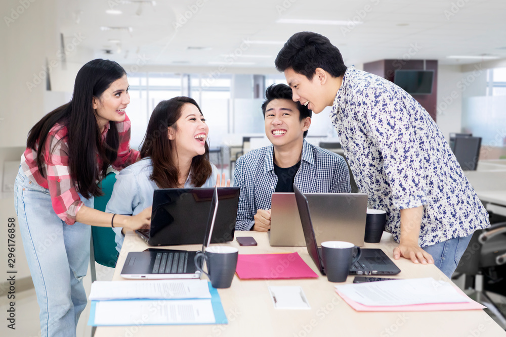 Business people laughs and works in the office Business people laughs and works in the office
