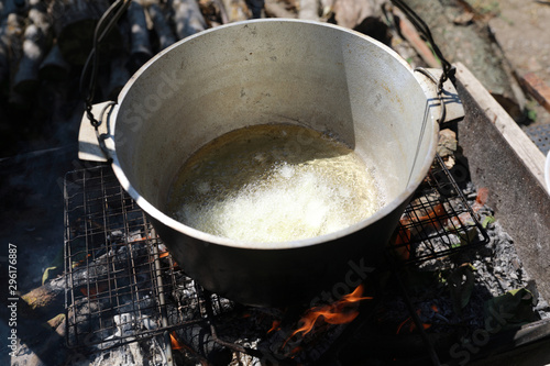 Frying onions in cauldron