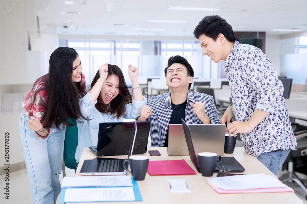 Business team clenched fist to celebrating success