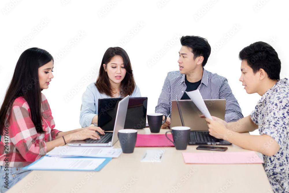 Busy business team working with laptops on studio Busy business team working with laptops on studio