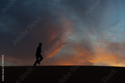 silhouette of man in the desert © omer_kuru