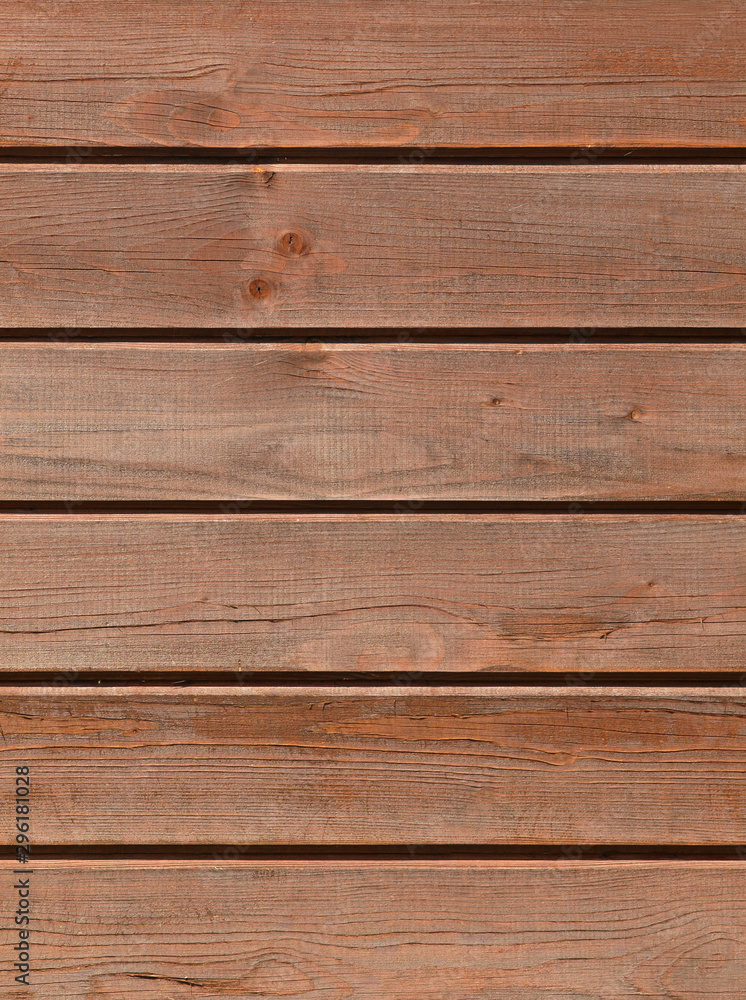 Brown wooden background with detailed wood structure with knots and nail holes. Dark wood texture background surface with old natural pattern