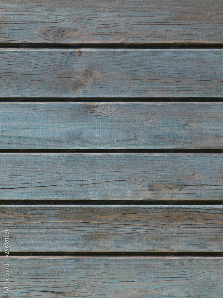 Blue wooden background with detailed wood structure with knots and nail holes. Dark wood texture background surface with old natural pattern