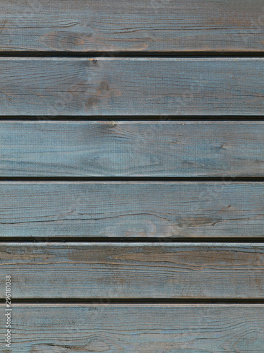 Blue wooden background with detailed wood structure with knots and nail holes. Dark wood texture background surface with old natural pattern