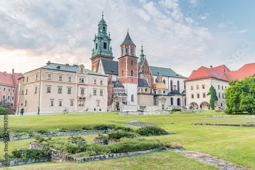 Evening view of Wawel Royal Castle complex with Wawel Cathedral or The Royal Archcathedral Basilica of Saints Stanislaus and Wenceslaus at sunset.