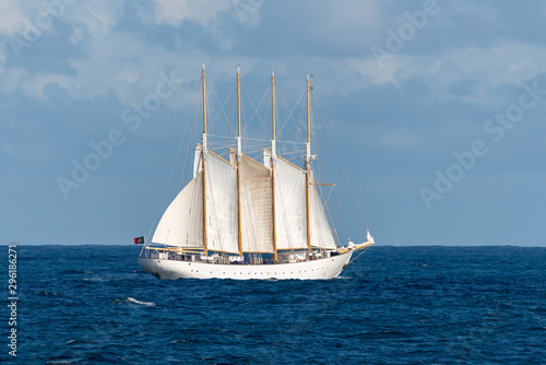 Sailing ship with four white sails