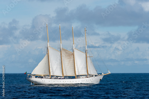 Sailing ship with four white sails