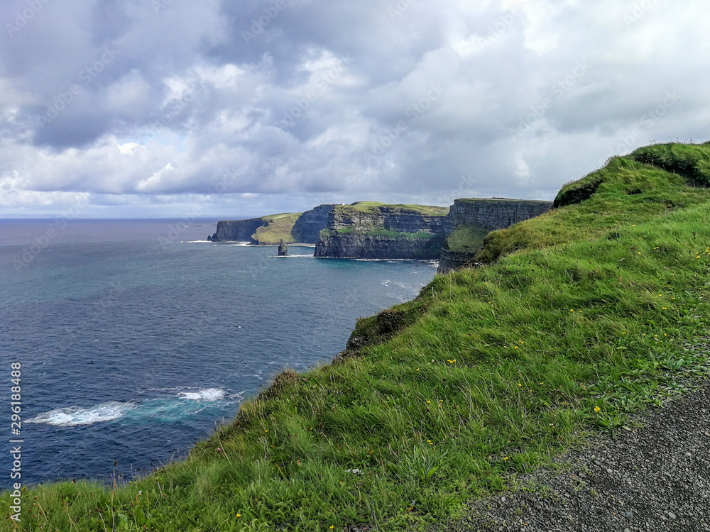 View of the famous Cliffs of Moher in County Clare, Ireland - taken on a sunny summer day View of the famous Cliffs of Moher in County Clare, Ireland - taken on a sunny summer day