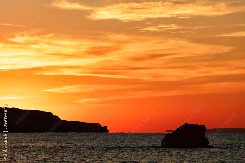 Crimea, Russia. Scenic sunset at Azov Sea coast known as Generals' Beaches. Rocky cliffs silhouettes at dusk. Beautiful seascape