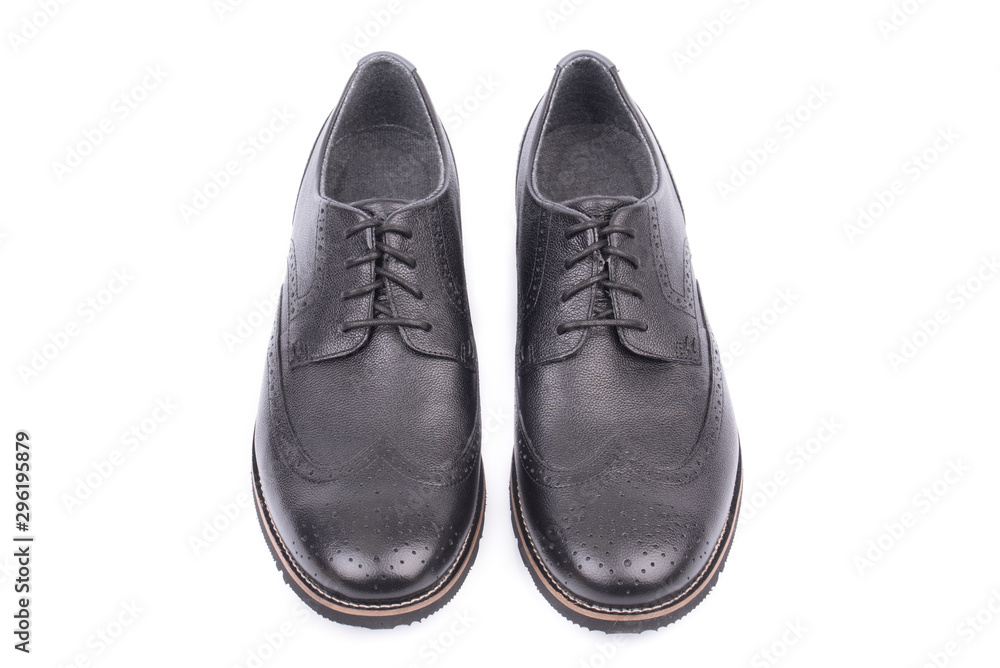 Black leather male shoes, white background. Men's ankle boot leather isolated on white background, closed up. For business and office. Official and casual,  footwear. Front, top view.