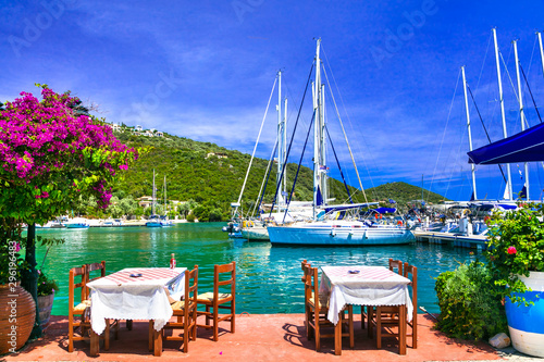 Traditional Greek restaurants (taverns) near the sea. Sivota fishing village in Lefkada island photo