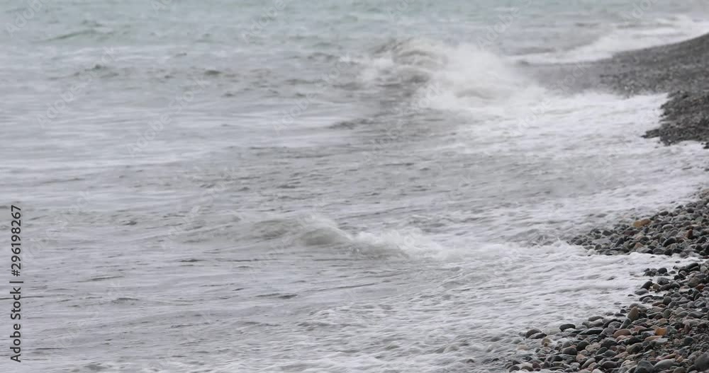 Sea Waves On A Pebbly Beach On A Summer Day. Sea Waves On A Pebbly Beach On A Summer Day.