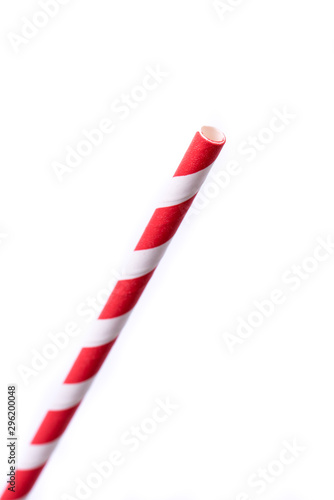Very closeup of drinking straw for party.  Pink spiral. Top view of colorful disposable eco-friendly straw for summer cocktails. Paper coctail colorful straw isolated on white  background, isolated.