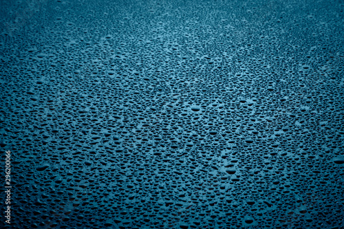 Water drops on dark surface.