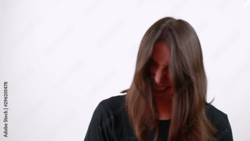 Brown-haired woman laughs. Happiness. Fun. White background Brown-haired woman laughs. Happiness. Fun. White background