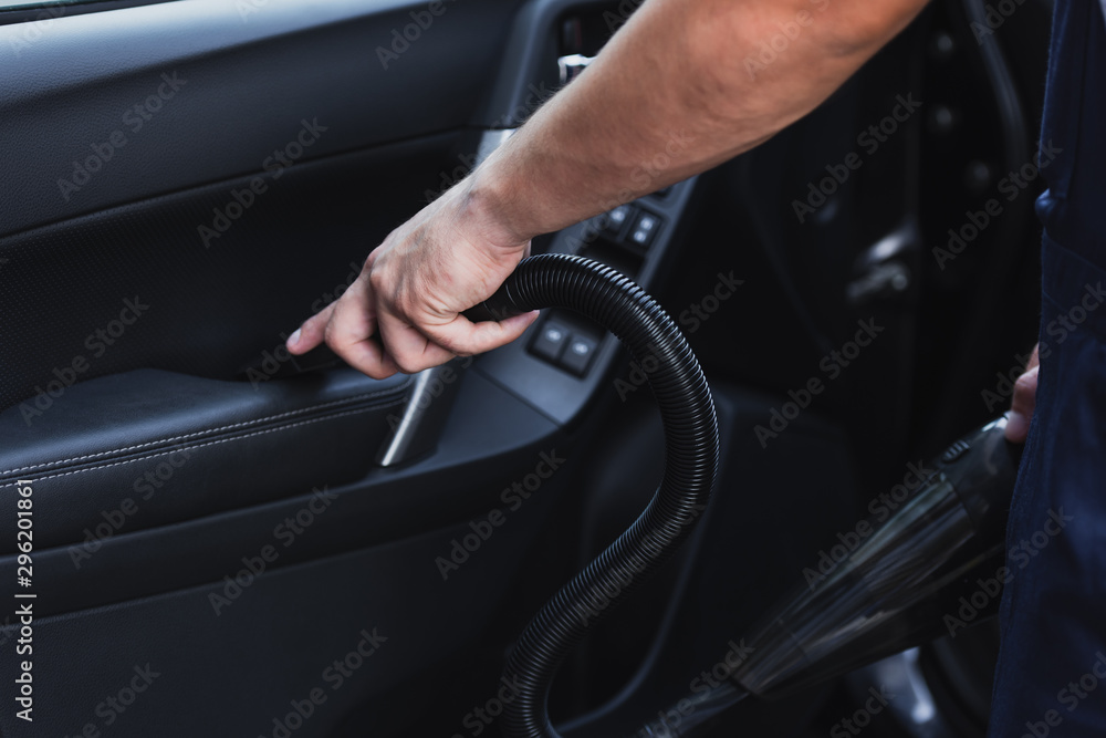 cropped view of car clean vacuuming car door