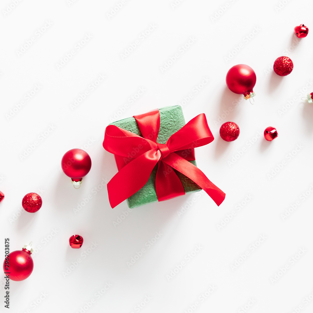 Christmas holiday composition. Gift box, red Xmas decorations on white background. Christmas, New Year, winter concept. Flat lay, top view, copy space Christmas holiday composition. Gift box, red Xmas decorations on white background. Christmas, New Year, winter concept. Flat lay, top view, copy space