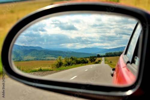 landscape seen through the rearview