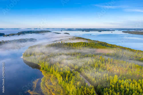 Aerial view of Pulkkilanharju Ridge, Paijanne National Park, southern part of Lake Paijanne. Landscape with drone. Blue lakes, fields and green forests from above on a sunny summer day in Finland. photo