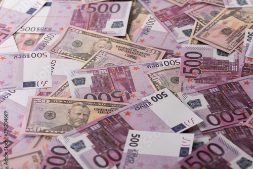 background of spread euro and dollar banknotes, sports betting concept