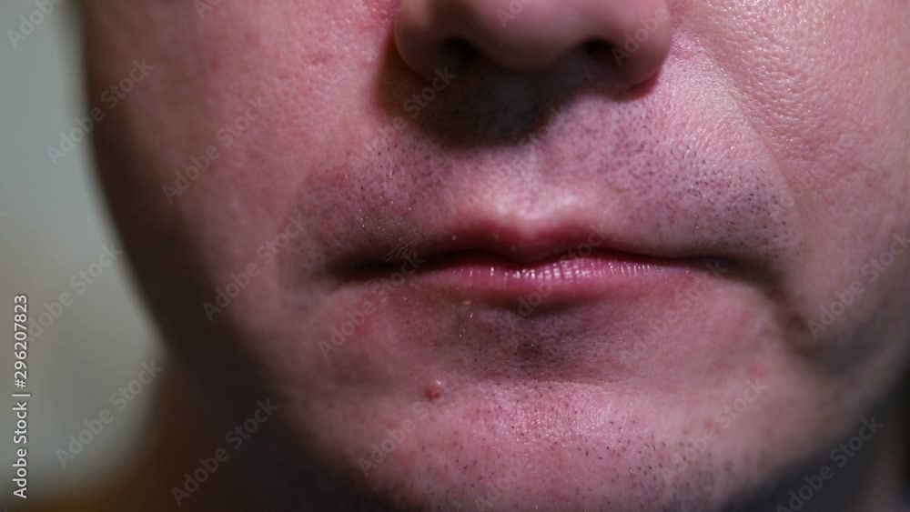 man eating fried potato slices. close-up man eating fried potato slices. close-up