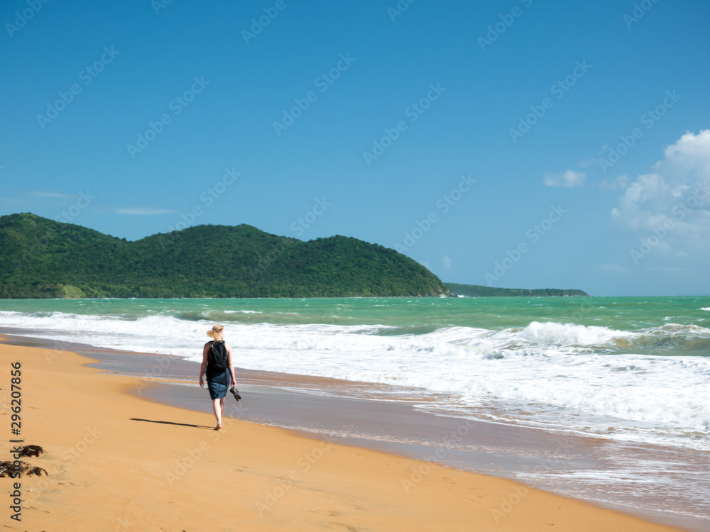 Young woman with blond hair on the beautiful Punta Tuna beach, Puerto Rico, USA