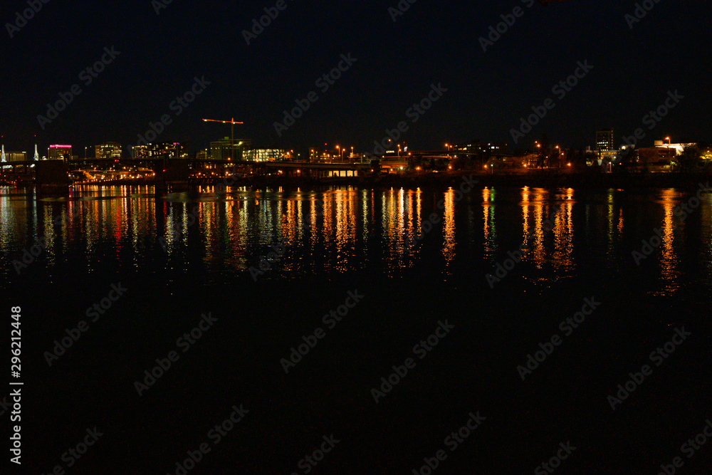 City at night, landscape. Beautiful night city with lights and reflection in the river. City at night, landscape. Beautiful night city with lights and reflection in the river.