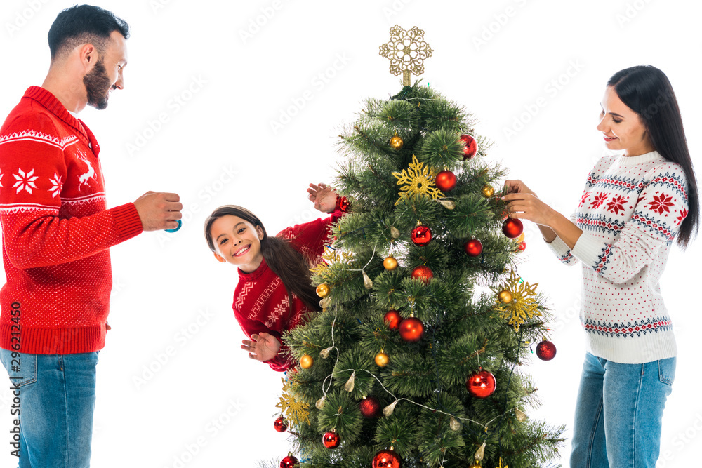 happy family decorating christmas tree isolated on white happy family decorating christmas tree isolated on white