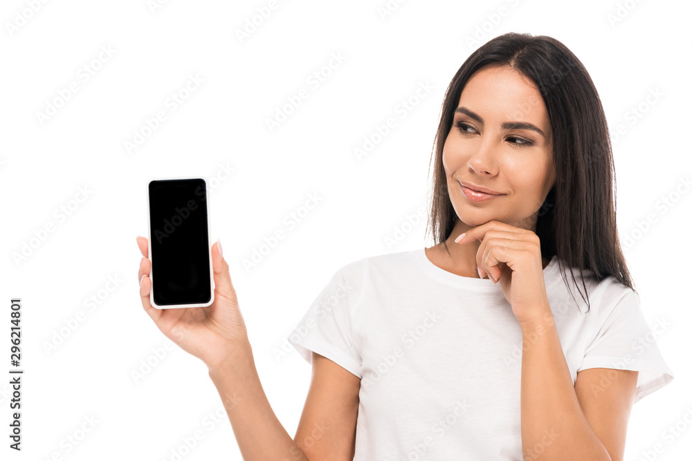 Fototapeta premium pretty woman looking at smartphone with blank screen isolated on white
