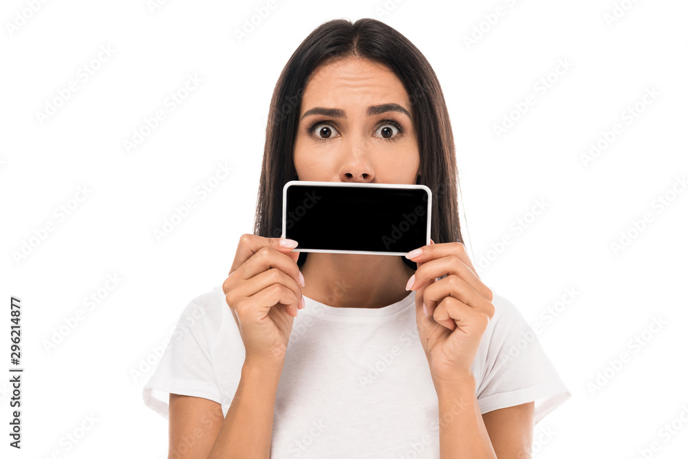 surprised woman covering mouth with smartphone isolated on white surprised woman covering mouth with smartphone isolated on white