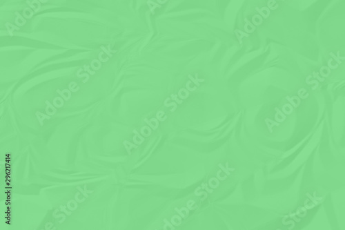 crumpled green paper background close up