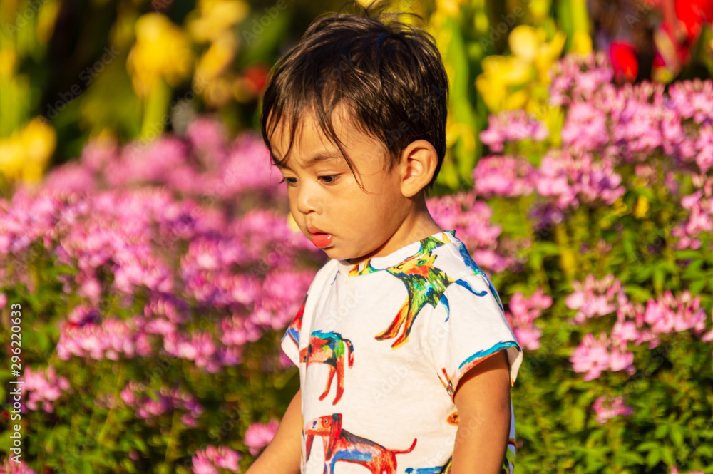 Cute Mexican American boy child is playing in a park in the city. Cute Mexican American boy child is playing in a park in the city.