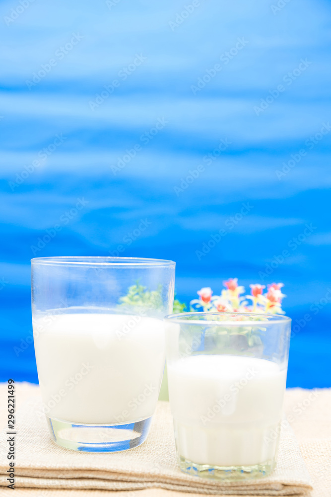 Milk in a glass on a wooden table Milk in a glass on a wooden table