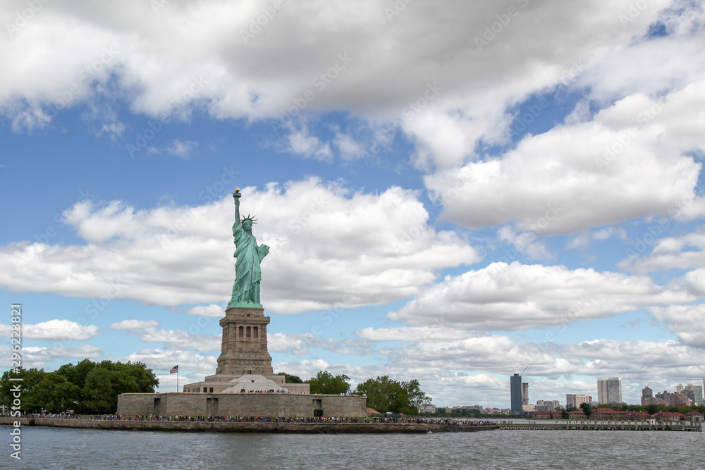 New york ,USA-June 15 ,2018:Tourist visit in front of the Statue of liberty is American landmark have famous in New York ,USA . New york ,USA-June 15 ,2018:Tourist visit in front of the Statue of liberty is American landmark have famous in New York ,USA .