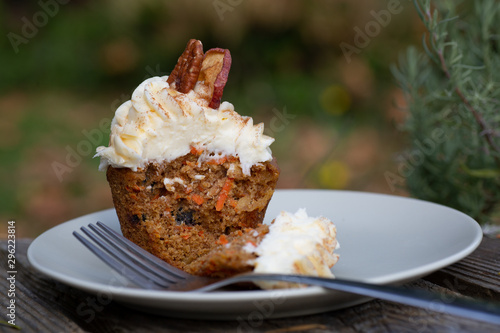 Carrot Cake Cupcake with Cream Cheese Icing with an Autumn Background