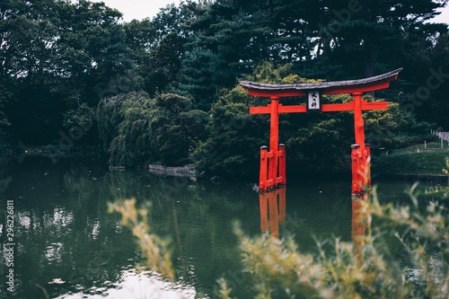 Peaceful Zen Torii Gate in the Middle of Calm Pond During Summer After Rain