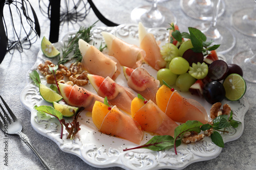 Appetizer with persimmon,fig, pear,walnut and prosciutto for holiday