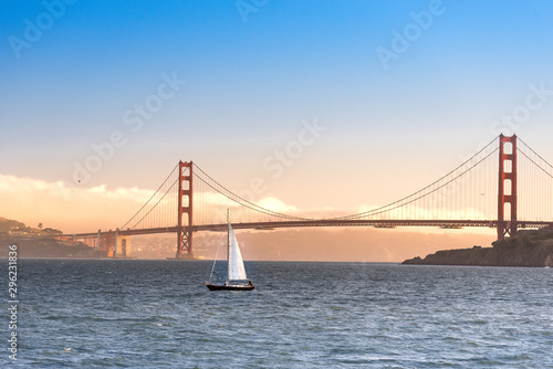 Golden gate bridge sunset with sailboat