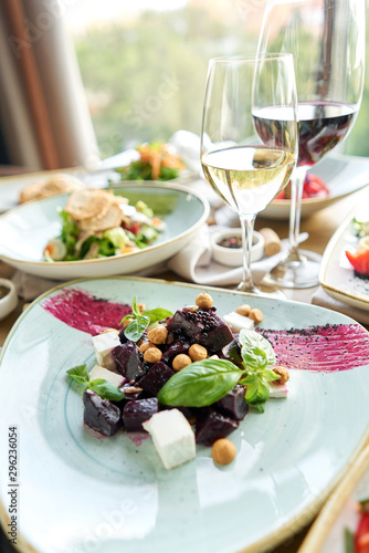 Healthy diet food. Italian salad with beetroot. Variety of dishes on the table. Various snacks and antipasti on the table. Restaurant menu. Italian cuisine