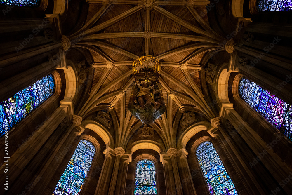Fototapeta premium EDINBURGH, SCOTLAND, DECEMBER 15, 2018: Bottom view of the dome of the Scottish National War Memorial, with an oak carving of St. Michael surrounded by beautifil stained glasses.