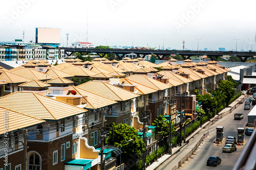 Residential houses are crowded in the capital housing villages. There is no green area and face stress from the problem of dust, smoke and dust in the capital. © Wisut