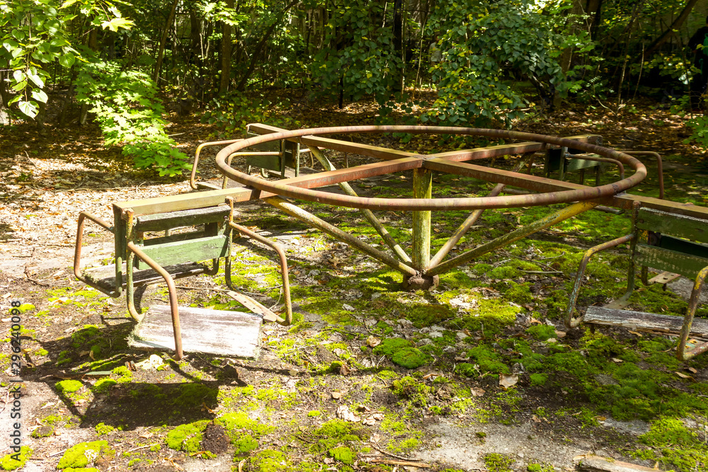 Unhappy childhood. Broken children's swing. Children's park with old broken swings. Unhappy childhood. Broken children's swing. Children's park with old broken swings.