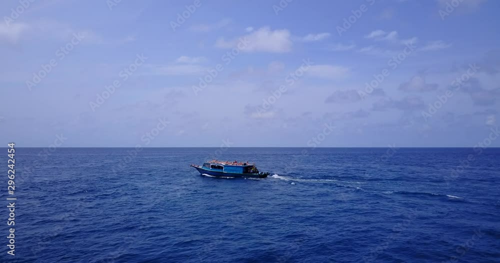 view of boat sailing in sea of caribbean, low altitude drone shot view of boat sailing in sea of caribbean, low altitude drone shot