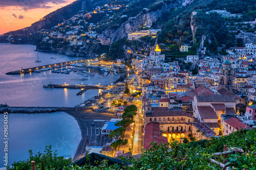 View of Amalfi after sunset on the coast of the same name in Italy © elxeneize