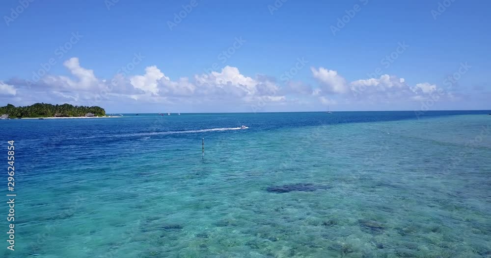 Jetski playing in turquoise water. Aerial orbit shot. at distance. Waves Jetski playing in turquoise water. Aerial orbit shot. at distance. Waves