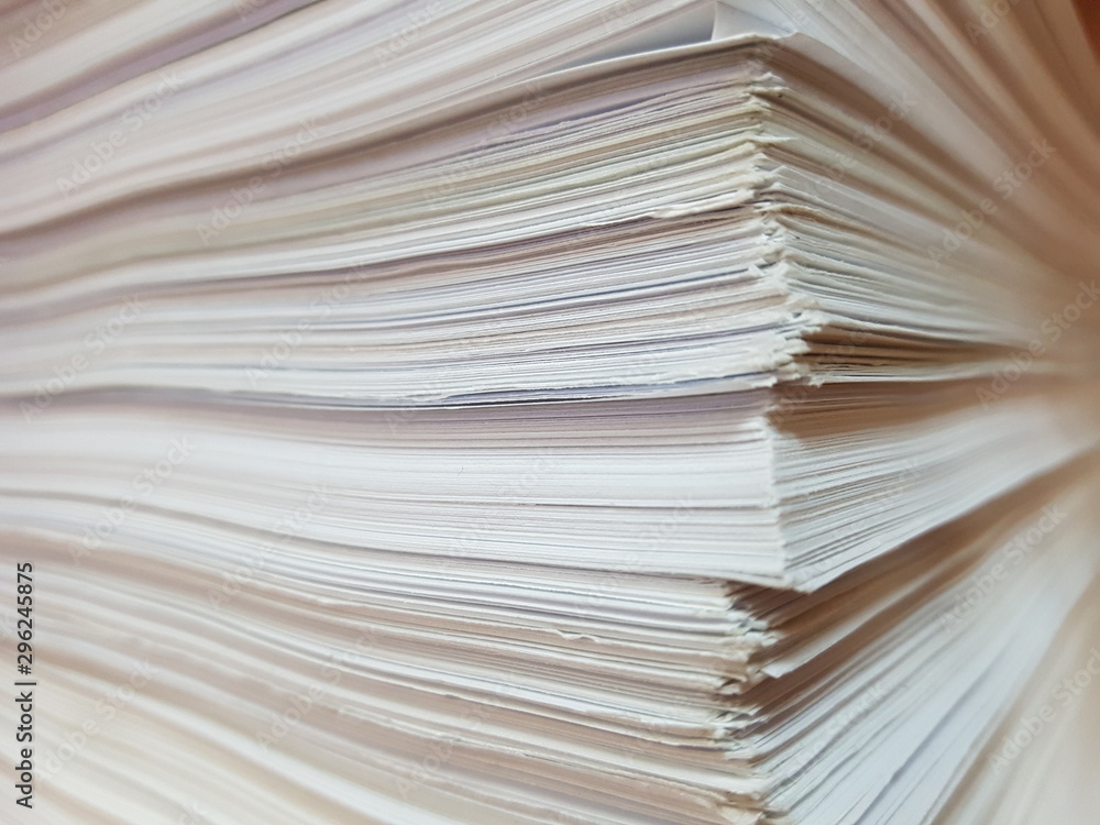 View of the edge of a bundle of sheets of white paper. View of the edge of a bundle of sheets of white paper.