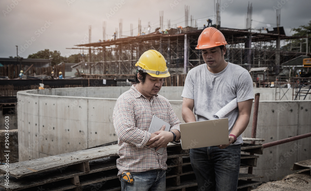 Architect and engineer discuss in building construction site. Stock ...