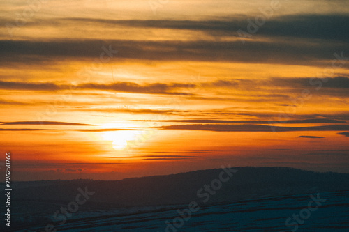 Fototapeta Naklejka Na Ścianę i Meble -  sunset over winter snowed field